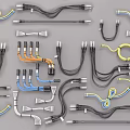 Assorted Colored Electrical Cables With Plugs And Connectors On Gray Surface