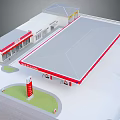Gas Station Building With Gray Roof Red Trim And Advertising Pillar Structure