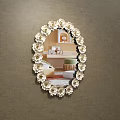 Oval Mirror With Floral Accents Reflecting Room Interior With Sofa And Carpet Against Brown Wall
