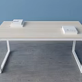 Light Wooden Top Desk With White Frame And Stack Of Books In Blue Wall Room