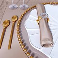 Elegant White Plate Tableware Set with Gold Cutlery Wine Glasses and Green Decorations