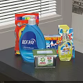 Daily Household Laundry And Cleaning Supplies With Bottles And Boxes On Dark Countertop