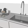 Stainless Steel Kitchen Faucet with Water Flowing into Modern Sink and Ceramic Items on Countertop