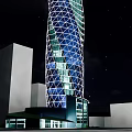 Modern Commercial Complex With Spiral Design And Diamond Shaped Glass Facade Against Sunset Sky