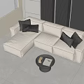Modern Cream Colored Three Seater Sofa With Black Cushions And Round Coffee Table
