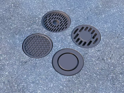 Four Round Manhole Covers with Different Grid Patterns on Gray Pavement 3d model
