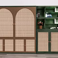 Green Bookshelf With Arched Rattan Doors And Open Shelves Featuring Potted Plant And Books