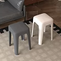 Gray and White Stools on Carpet with Sofa and Wooden Floor