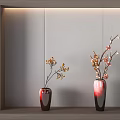 Red Ceramic Vases With Yellow Pink Flower Branches On Light Wooden Shelf Against Light Wall