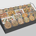 Fresh Assorted Pizzas In Glass Display Case With Various Toppings