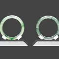 Two Elegant Natural Green Jade Bracelets On White Display Stands