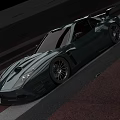 Dark Colored Sports Car With Aggressive Front Design Sharp Headlights And Roof Spoiler
