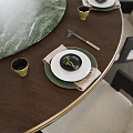Elegant Tableware Set With White Green Plates Black Bowl Gold Cup Chopsticks On Wooden Table