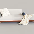 Modern White Lazy Sofa With Wooden Frame Knitted Pillow Blanket And Blue Ball Decor