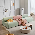 Living Room With Pastel Green Pink Sofa Yellow Plush Toys Round Coffee Table Orange Decor