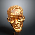 Golden Human Head Sculpture Showcasing Detailed Facial Features And Shiny Surface