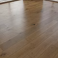 Natural Brown Wooden Flooring With Smooth Polished Surface And Wood Grain Patterns