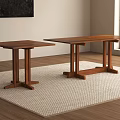Two Wooden Dining Tables On Light Woven Rug With Window And Wall Art