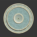 Multi Tiered Circular Fountain Design With Blue Water And Light Colored Edges