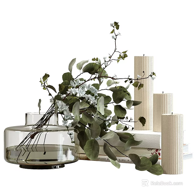 Transparent Glass Vase With White Flowers And Green Leaves Next To White Candles And Books 3d model 