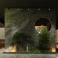 Japanese Style Restaurant Interior With Stone Wall Circular Window Green Plants And Wooden Furniture