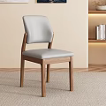 Light Gray Upholstered Dining Chair With Wooden Legs In Modern Living Room Setting