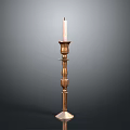 Elegant Brass Candle Holder Stand With Lit White Candle And Detailed Design