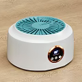 White Round Washing Machine With Blue Grille And Digital Display On Wooden Floor