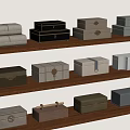 Various Colored Storage Boxes With Different Materials Neatly Arranged On Wooden Shelves