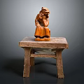 Rustic Wooden Table With Hand Carved Decorative Figure On Top