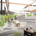 Modern Commercial Street With Outdoor Seating Green Plants And Leisure Areas