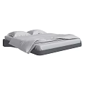 Modern Double Bed With White Linens Pillows And Sleek Frame