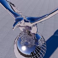 Metallic Eagle Sculpture With Spreading Wings On Globe Base Against Blue Sky 3d model