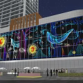 Night View Of Large LED Screen With Colorful Marine Life Sun Trees Tall Buildings Pedestrians