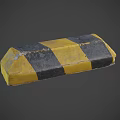 Yellow And Black Striped Traffic Safety Barrier Block With Worn Surface