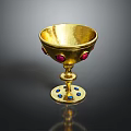 Elegant Golden Decorative Cup With Red Gemstones And Blue Stones On Base