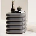 Modern Gray And White Stacked Nightstands With Table Lamp Vase Flowers Books And Small Bowl
