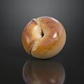 Golden Brown Bagel With Shiny Surface On Dark Background And Clear Reflection