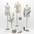 Fashion Mannequins On Display Stands With Handbags Shoes And Green Plant In White Background
