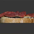 Fresh Toasted Bread Topped with Savory Salami Slices and Butter