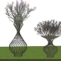 Ornamental Trees In Wicker Vase Shaped Planters With Purple Flowers On Green Lawn