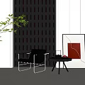 Modern Black Accent Chair With Metal Frame Side Table Green Plant And Grid Wall Artwork
