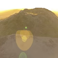 Natural Garden Landscape With Green Brown Mountains Under Sunlight Glow