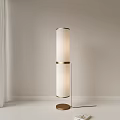 Modern Standing Lamp With Cylindrical White Shade And Gold Metal Frame For Interior Decoration