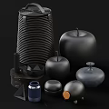 Modern Minimalist Ornamental Decor Set with Black Stacked Discs Apple Shaped Ornaments and Geometric Containers