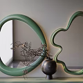 Green Oval And Flower Shaped Mirrors With Black Vase And Twig Decor In Modern Interior