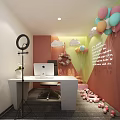 Public Office Space With White Desk Apple Computer Ring Light And Colorful Balloons