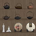 Traditional Tea Ware Display On Wooden Shelves With Various Teapots Tea Cakes And White Statues