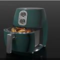 Green Air Fryer With Open Drawer Containing Fried Food And Control Knobs