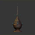 Ornamental Metal Home Decor Piece With Carved Design Blue Beads Hanging Chains And Circular Base